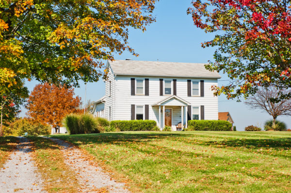A house in the fall with fall foliage